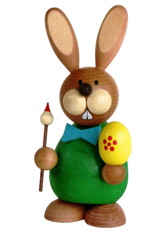 Easter bunny sitting with brush and egg, 12.0 cm tall