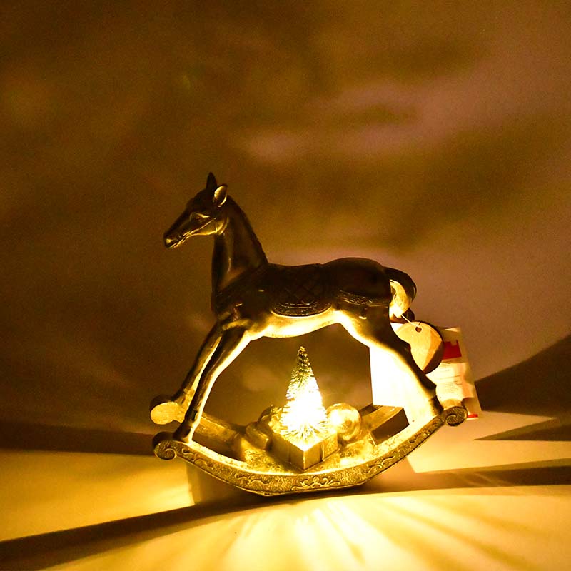 Figur Golda, 2 sort., Schaukelpferd, LED H 21 cm, Kunstharz gold