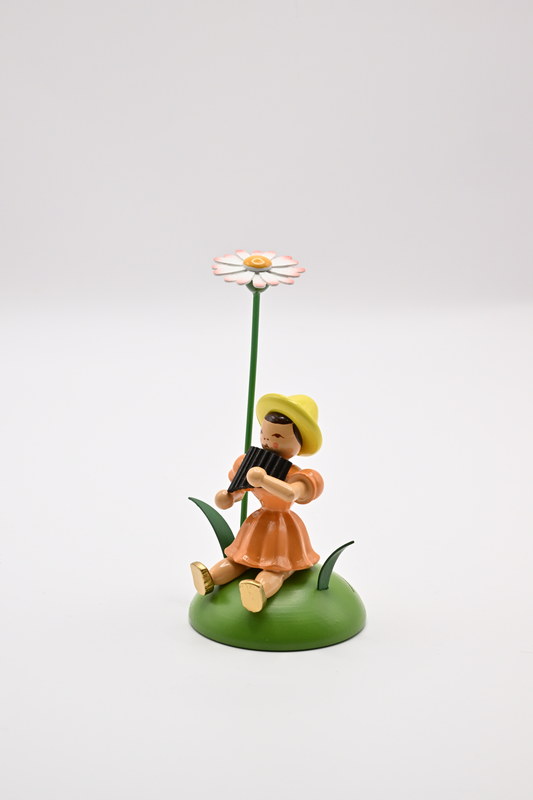 Daisies, pan flute, flower child sitting