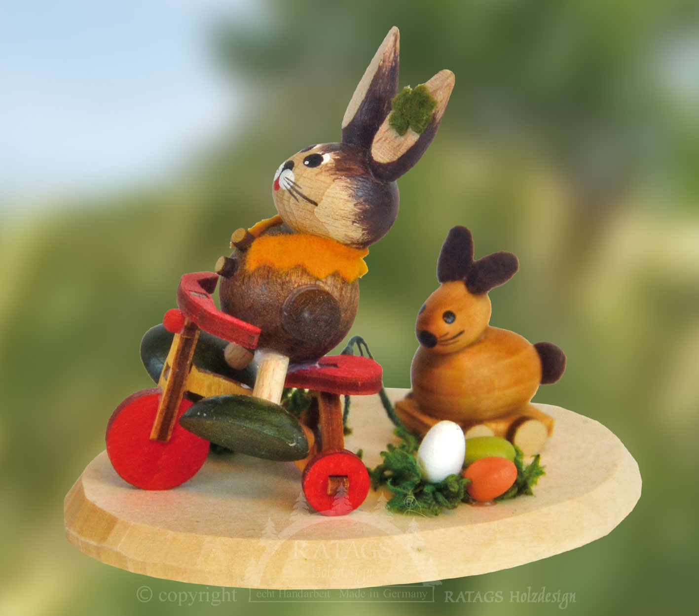 Rabbit meadow with tricycle and pull-along rabbits