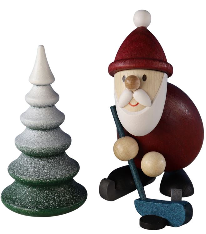 Weihnachtsmann Eishockeyspieler mit verschneiten Baum
