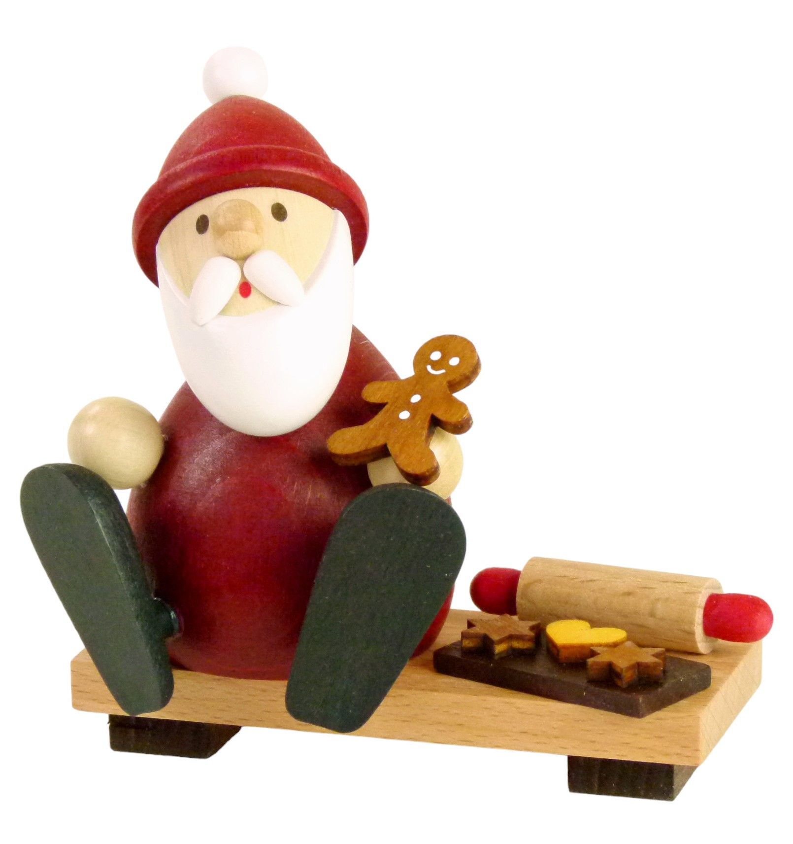 Santa Claus on bench with gingerbread man baking tray + rolling pin