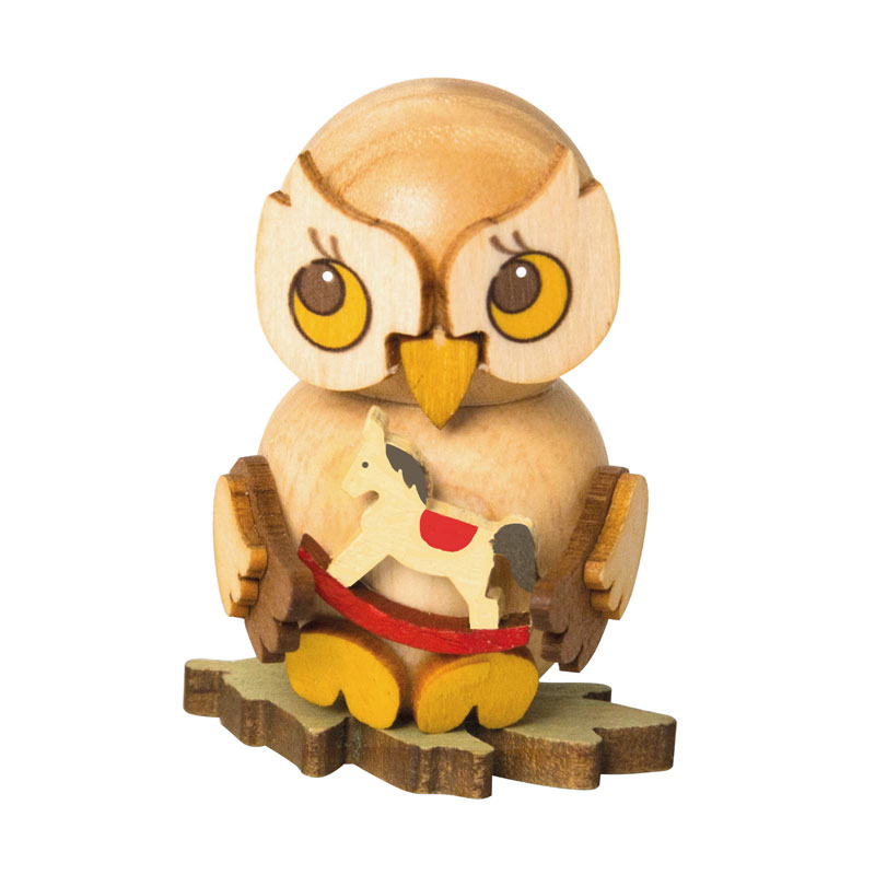 Owl child with rocking horse