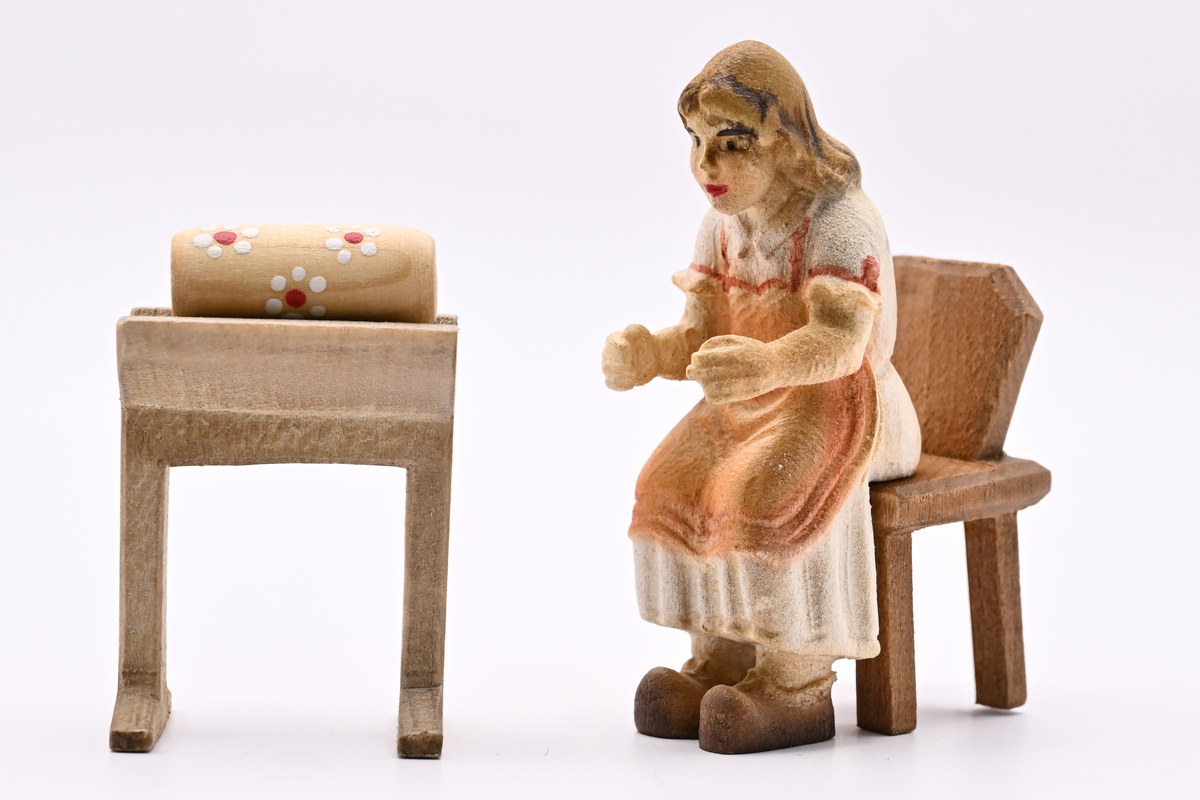 Bobbin lacemaker with bobbin bench, coloured, 35 x 65 mm