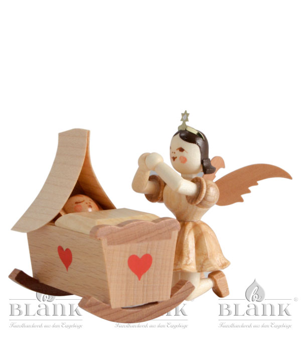 Wiege und Engel kniend