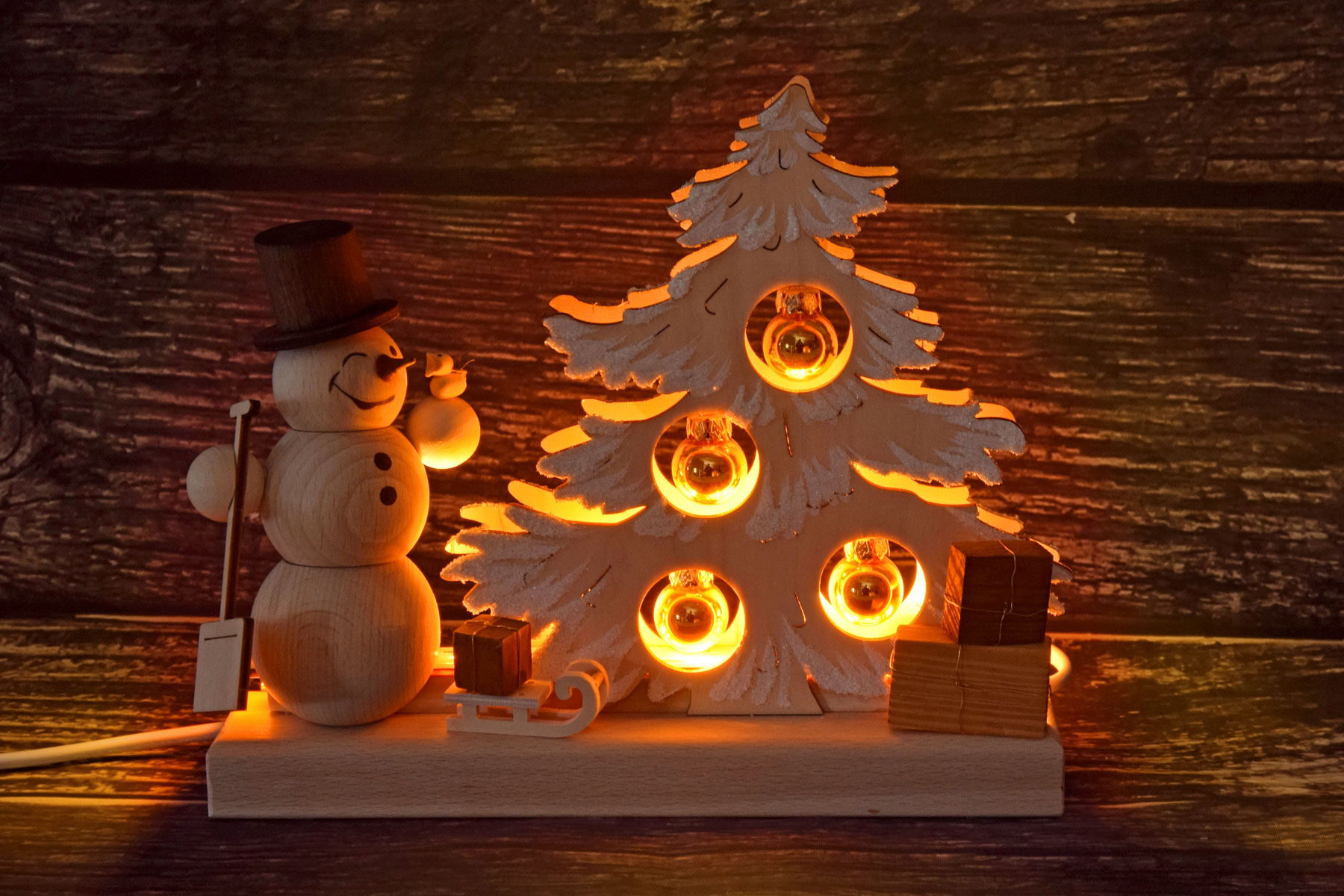 Table decoration Christmas tree, gold hoarfrost baubles, snowman