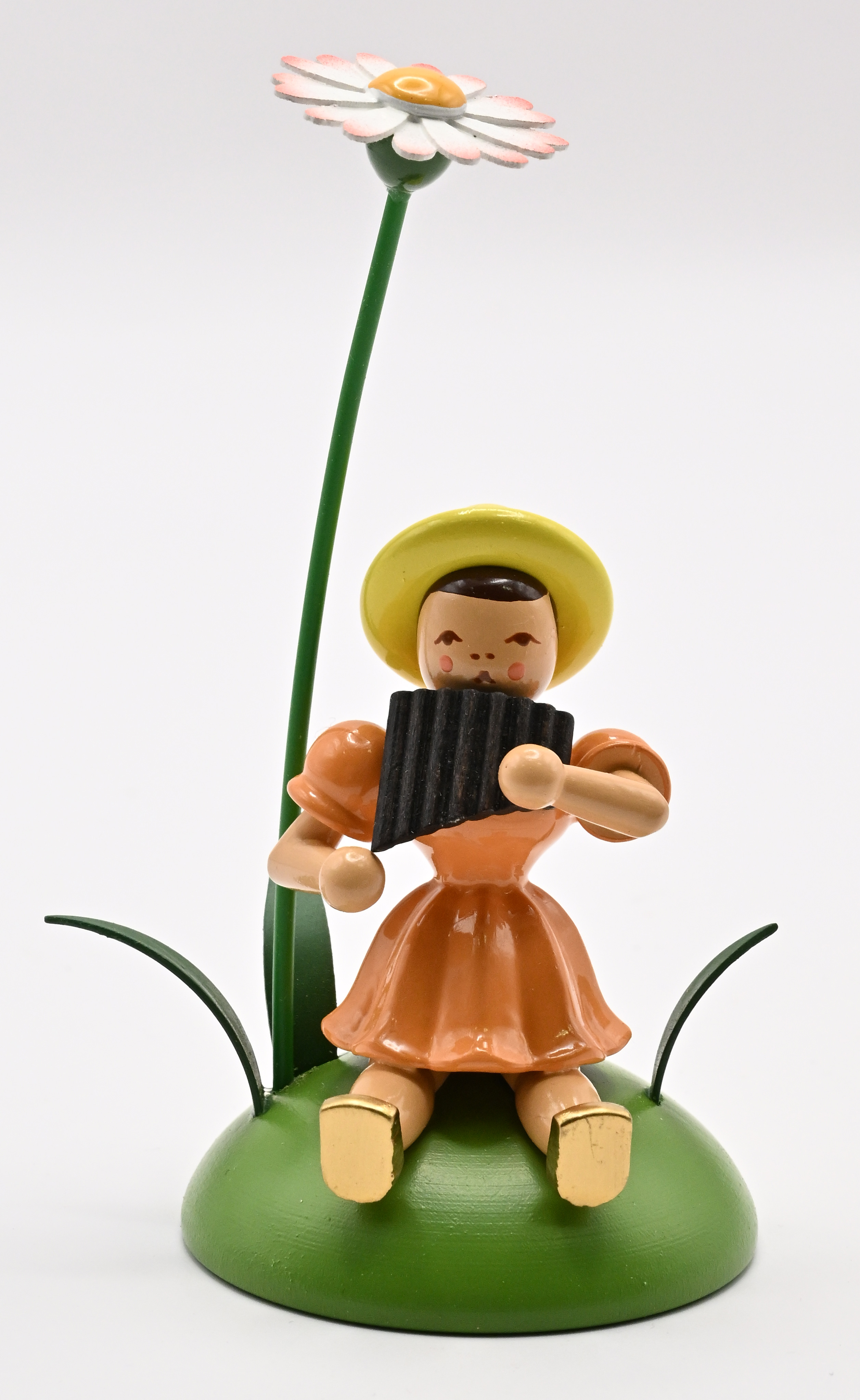 Gänseblümchen, Panflöte Blumenkind sitzend
