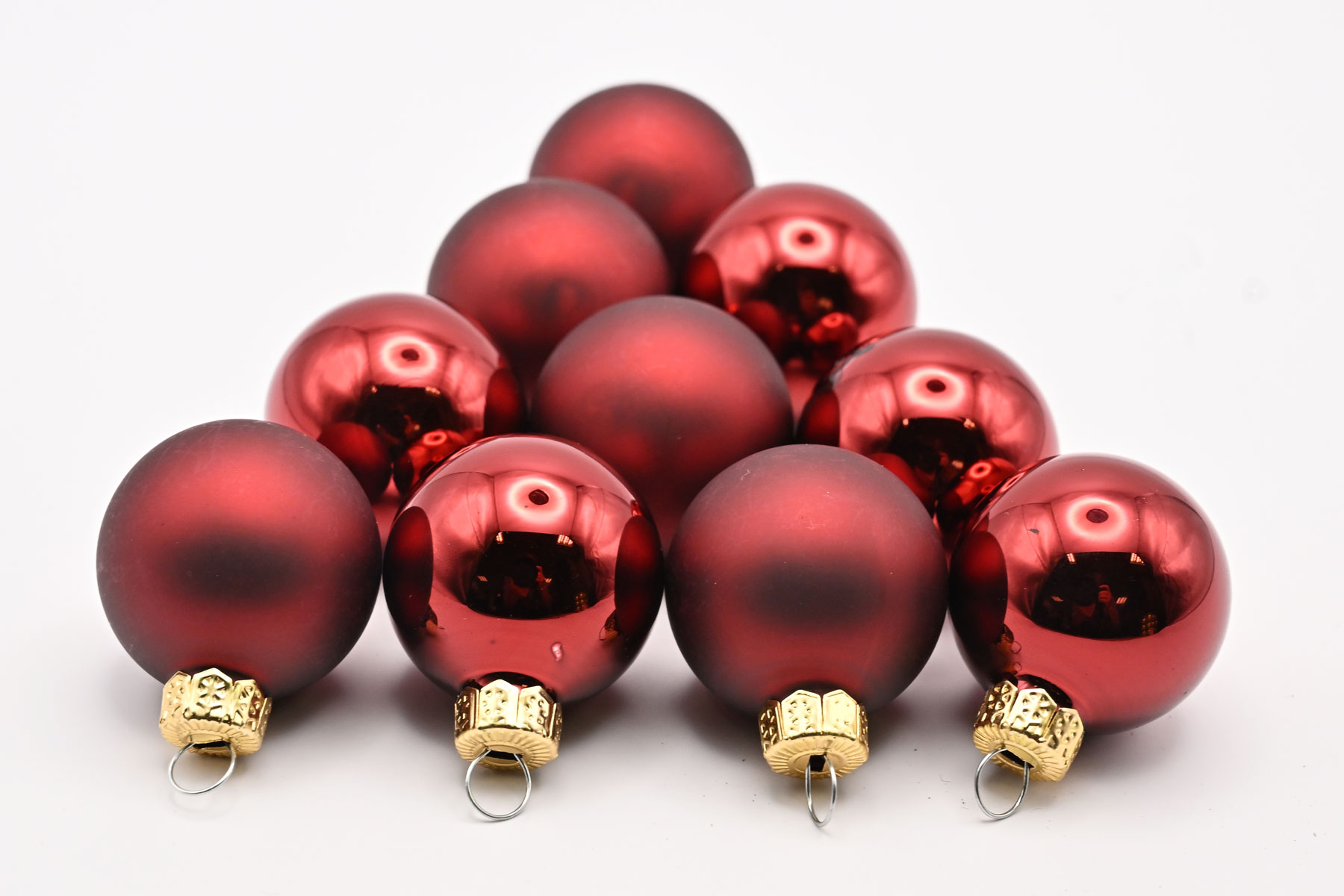 cb. 18 glassballs/cap dark red combi