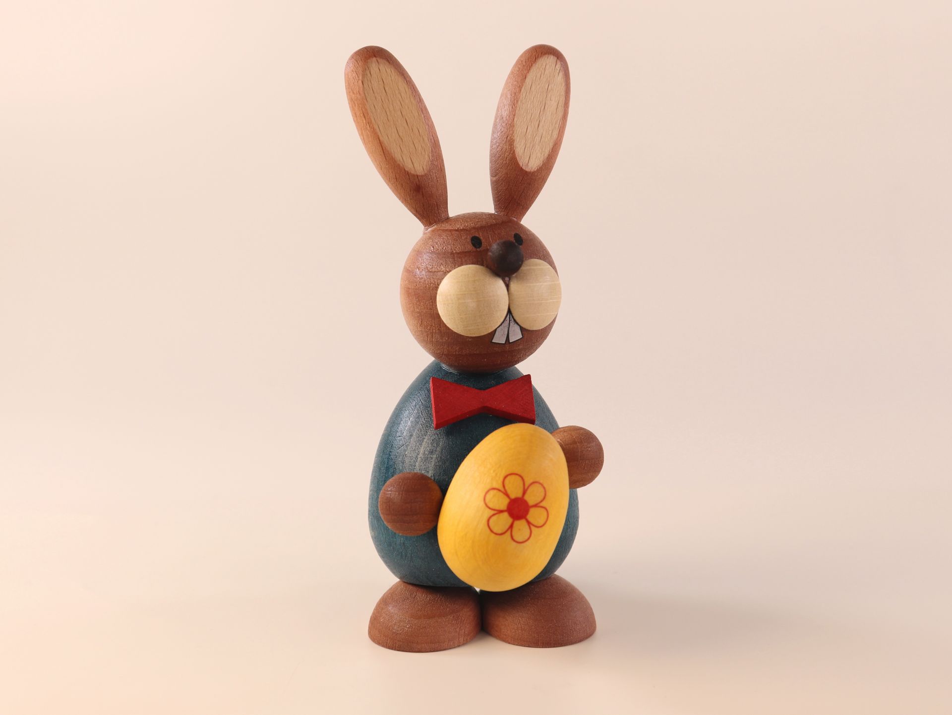 Easter bunny standing with yellow egg 5.5 cm x 11.5 cm (W x H)