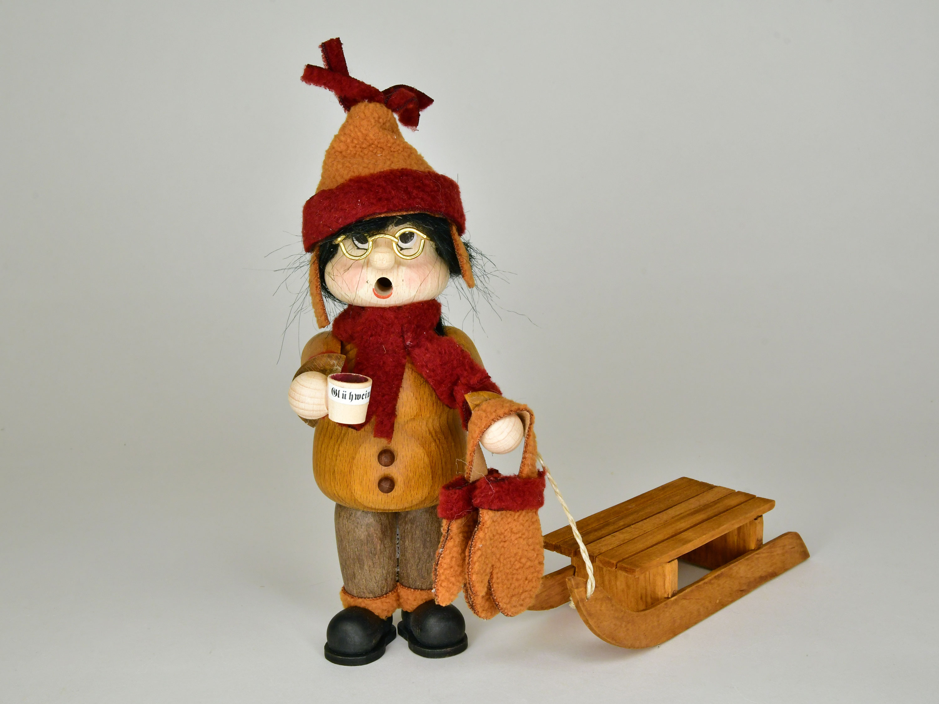 Thick, winter sportswoman with sledge