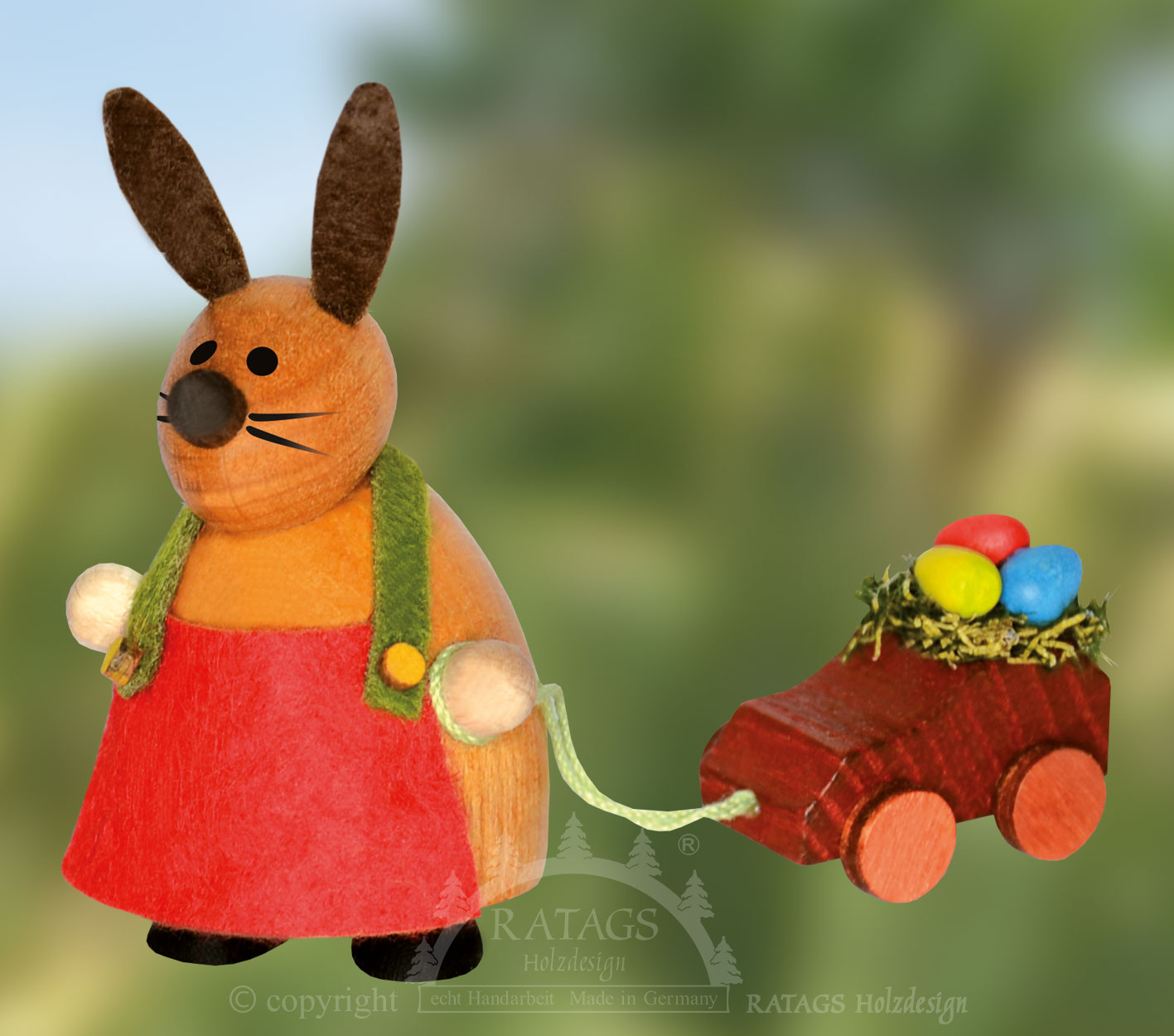 Bunny with toy car, red apron