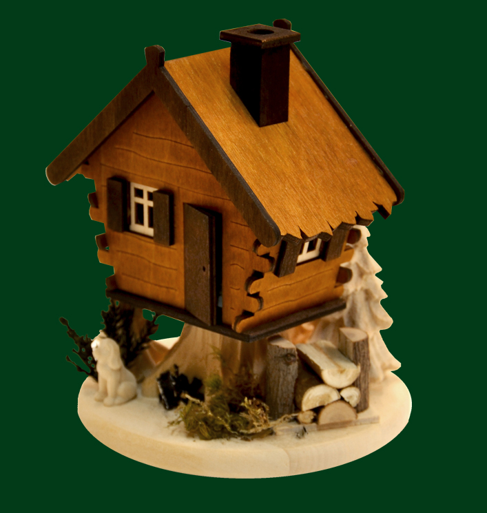 Table decoration with incense house, tree house