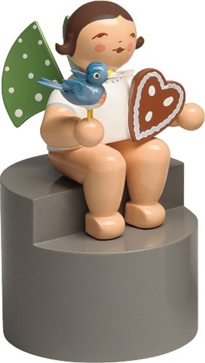 Engel mit Lebkuchen und Vogel, auf Podest, dunkles Haar