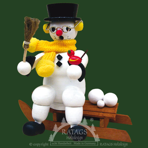 Kantenhocker, Schneemann auf Schlitten gelber Schal Kantenhocker, Schneemann auf Schlitten gelber Schal