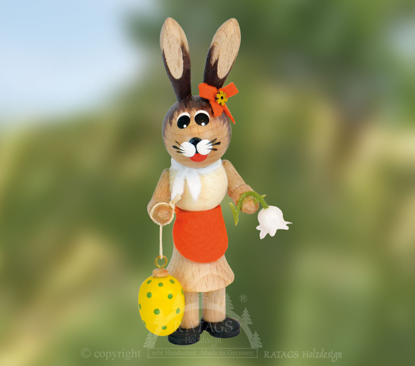 Osterhäsin, orange, mit Blume und Ostere