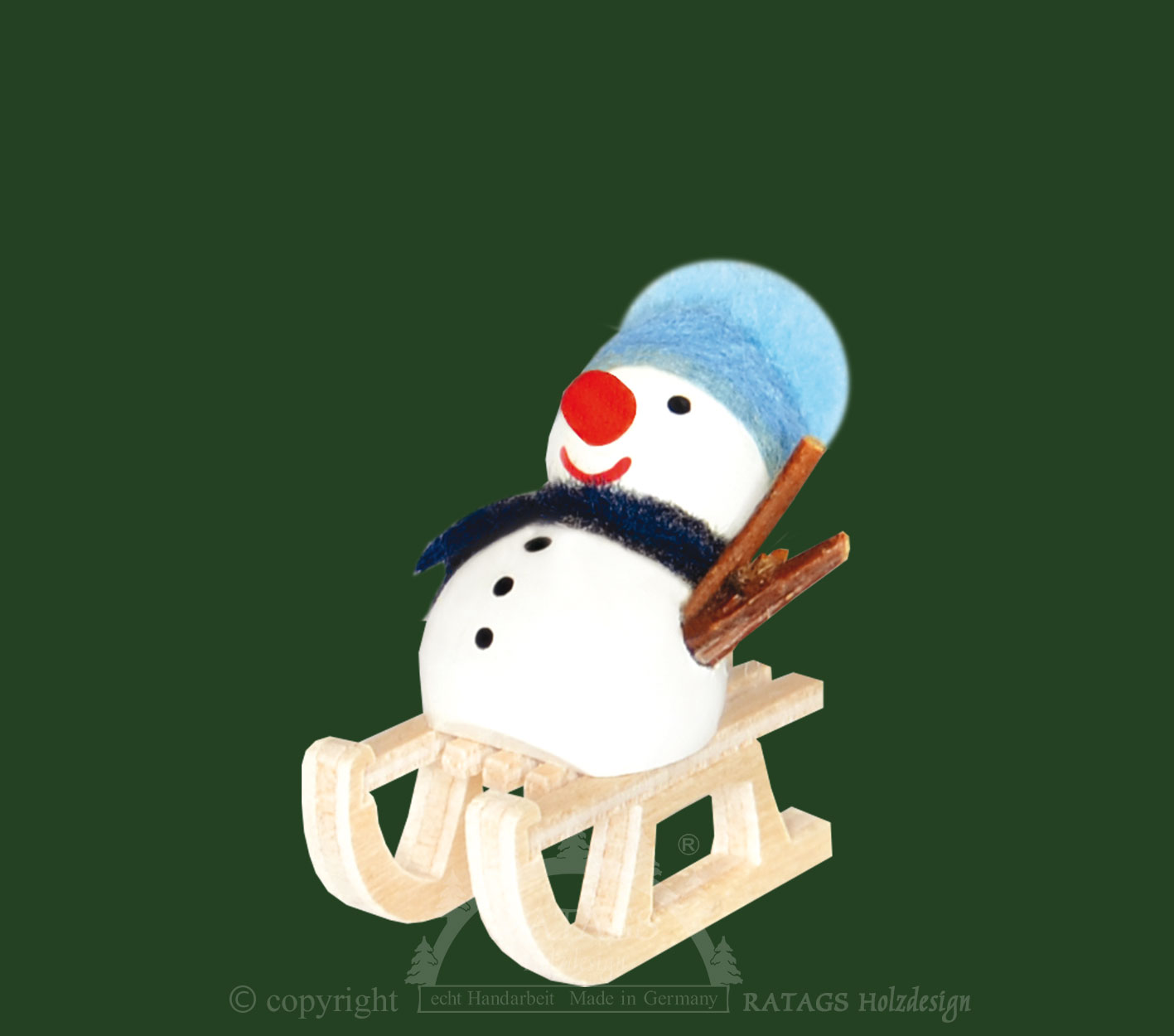 Snowman on a sledge, blue hat