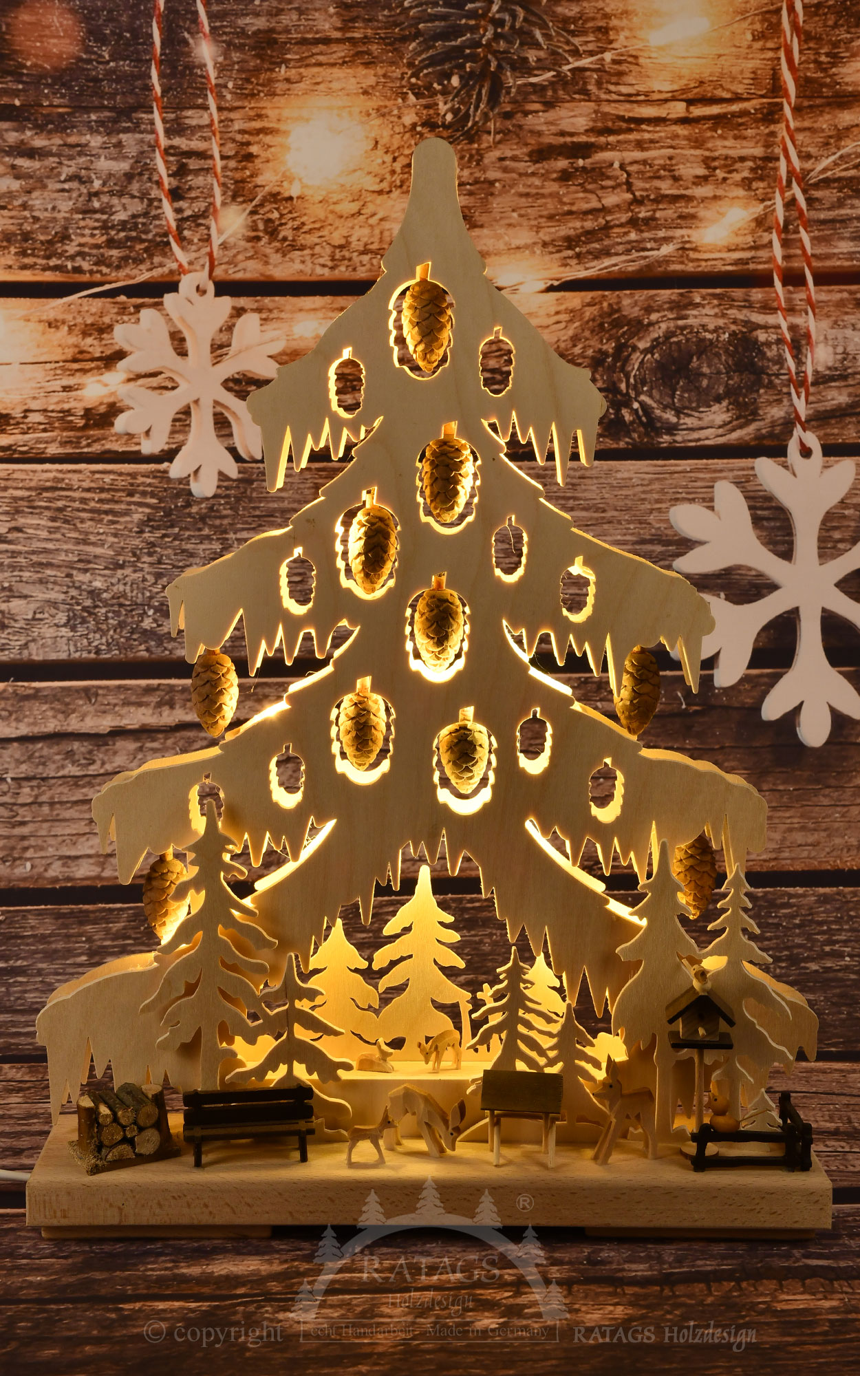 Small fir tree, animals in the forest, nature, carved pine cones and deer