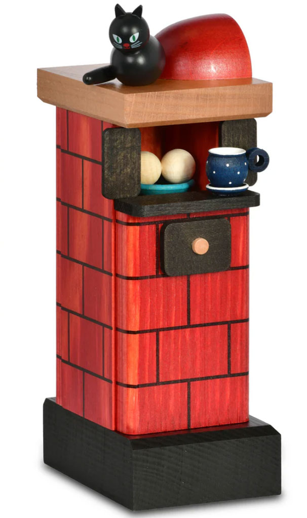 Poêle en faïence rouge fumant, bonhomme fumant