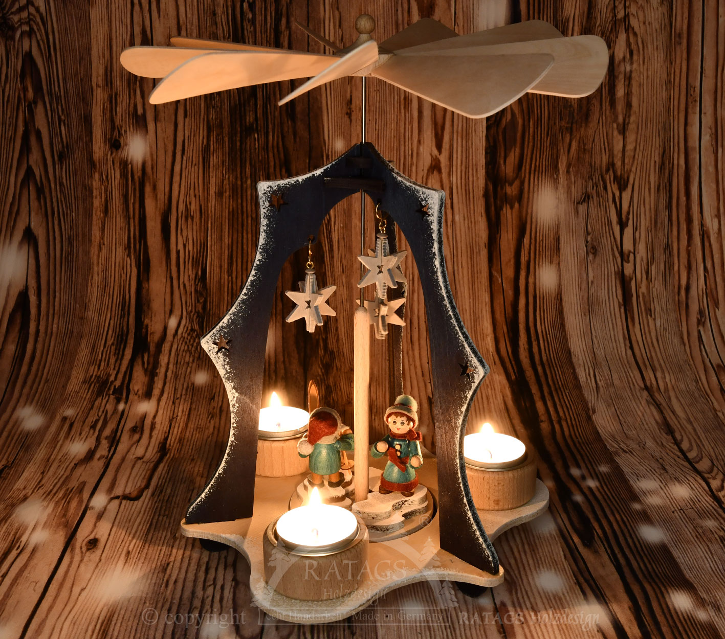 Blue triangular pyramid with 2 figures and stars