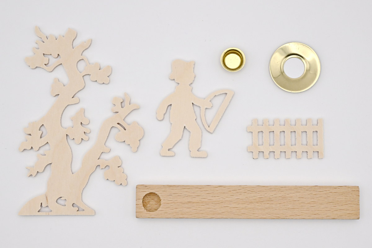 Candle holders for crafting, boy with saw at tree