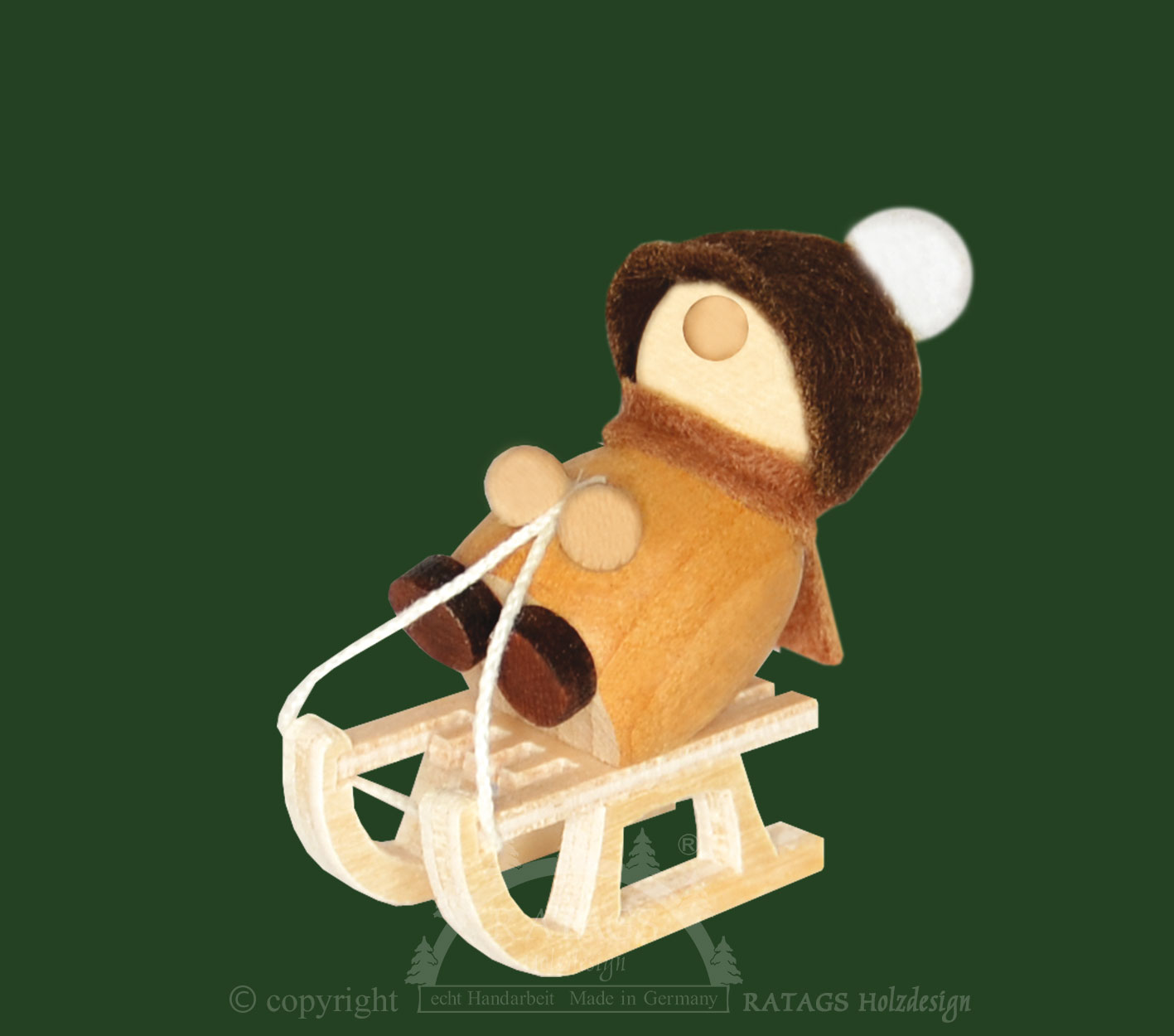 Mini Molli on a sledge, sitting, brown