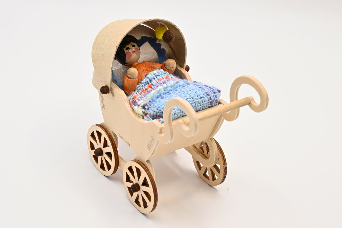 Pram with baby, white blanket