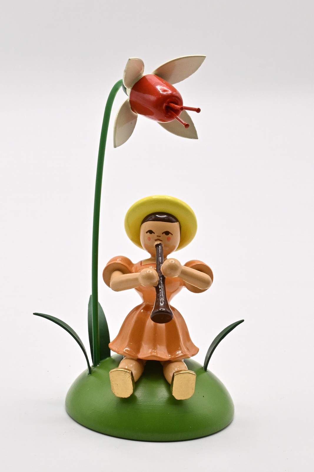 Fuchsie, Klarinette Blumenkind sitzend Fuchsie, Klarinette Blumenkind sitzend